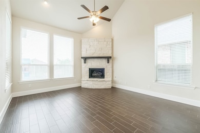 Open living area with stone fireplace