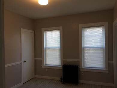 This spacious room with pocket door has been used 