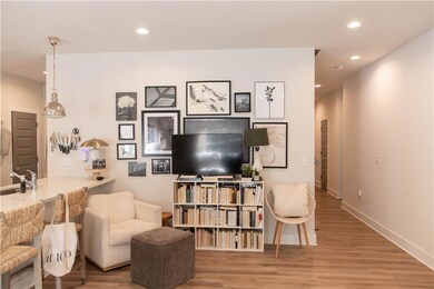Living room featuring recessed lighting, wood finished floors, and baseboards