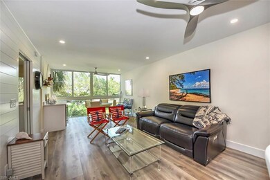 Living area with a ceiling fan, recessed lighting,