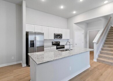 Kitchen featuring appliances with stainless steel