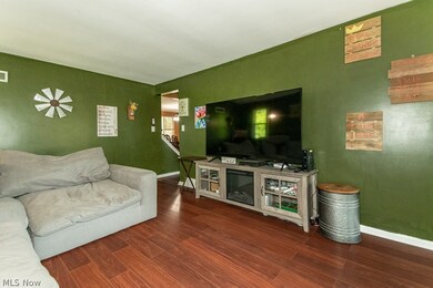 Living room with wood-type flooring