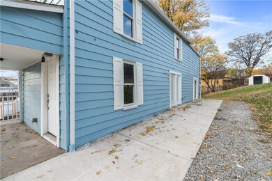 Front porch to left with new poured patio and fres