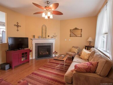 Living room is cozy yet large enough for full sofa