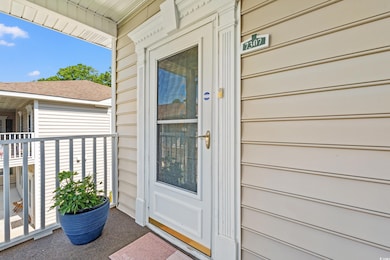 Property entrance featuring covered porch