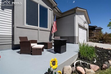View of patio with an attached garage