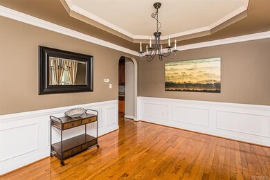 Spacious formal living room with tray ceiling, pic
