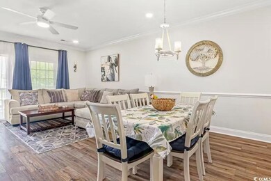 Dining space featuring ornamental molding, ceiling