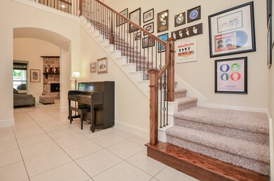 Beautiful Staircase and Open Entry Way.