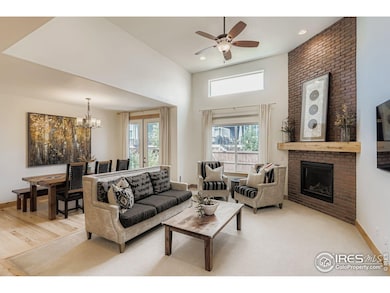 Cozy up by the brick fireplace or host with ease in this open-concept living and dining space.