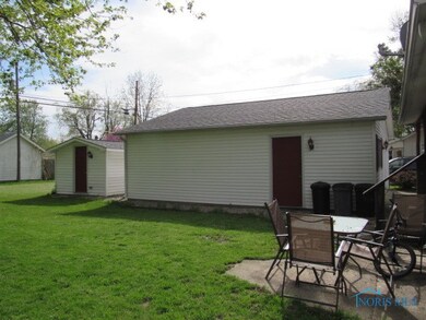 Side of garage & shed