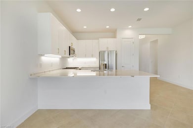 Kitchen with light tile patterned flooring, kitche