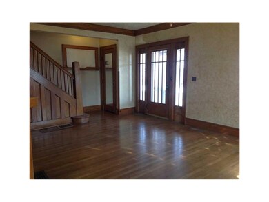 Living Room. Wood floors, trim, stairs