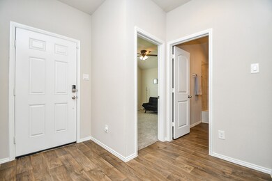 Pale, cool walls are complemented by durable floor