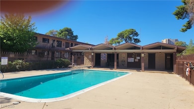 Community pool with a patio area