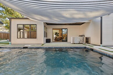 Saltwater pool and collapsable doors open to livin