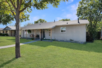 Single story home with a front lawn, covered porch, brick siding, and roof with shingles