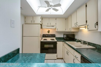 Kitchen overlooks dining and living area