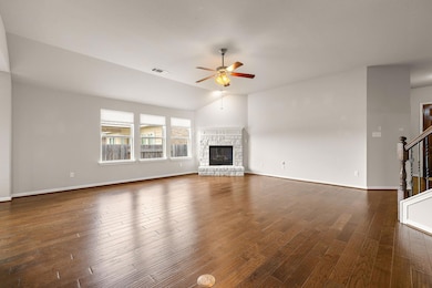 Unfurnished living room featuring dark wood-style