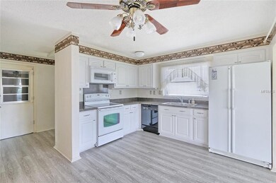 Tastefully updated kitchen! Newer flooring! White 