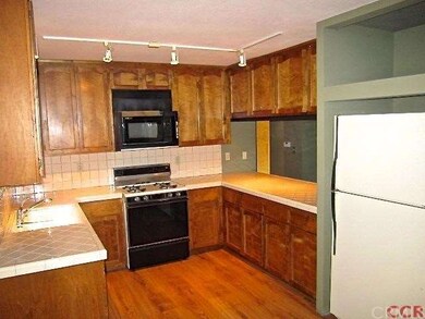Tile counters in the kitchen, appliances included