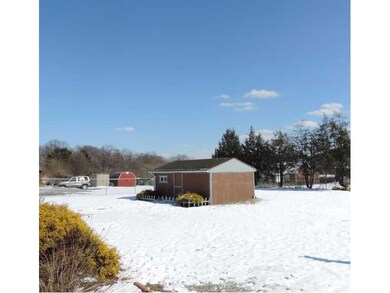 Exterior Back. Large, flat, fenced-in back yard is