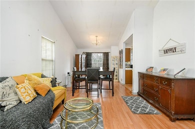 Living room featuring an inviting chandelier and l