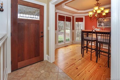 Beautiful tile and wood flooring greets you inside