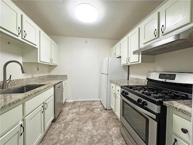 Kitchen with appliances with stainless steel finis