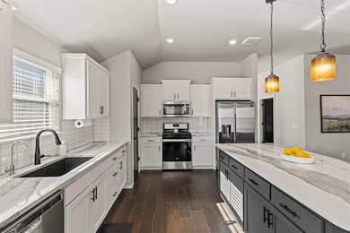 Kitchen with visible vents, appliances with stainl