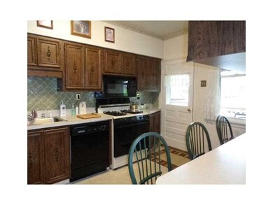Kitchen. Kitchen with built-in Dishwasher.  Door l