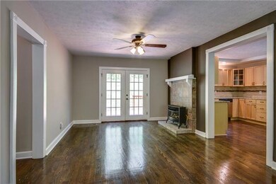 Dining area w/French doors out to deck in backyard