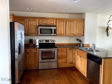 Hardwood floors and stainless steel appliances