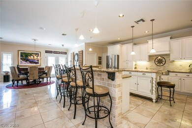 Plenty of custom cabinets, granite counter-tops, m