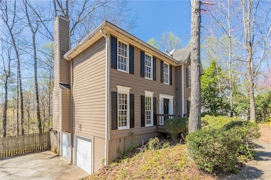 View of home's exterior featuring driveway, a gara