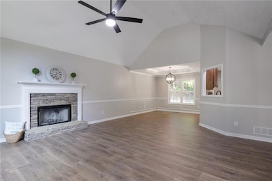 The open floorplan is ideal for both everyday living and entertaining, with fresh new flooring and paint throughout. The heart of the home offers seamless flow between the living, dining, and kitchen areas.