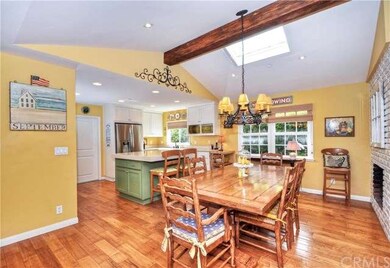 The pitched ceiling with wood beam adds immediate 