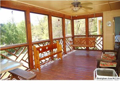 Huge screen porch overlooks the picturesque back y