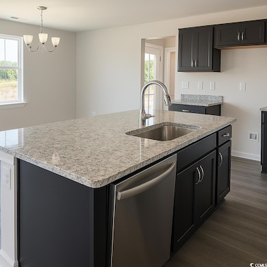 Kitchen featuring visible vents, a sink, LVP flooring, an island with sink, and stainless steel dishwasher