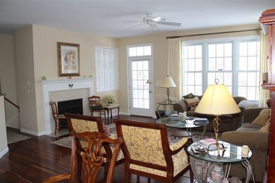 Gas fireplace and bright living area.