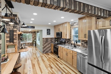 A versatile farmhouse kitchen with ample space for preparing daily meals or canning the bounty from your garden harvest—truly a space designed for both function and tradition.