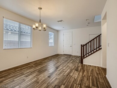 Dining room with light fixture.