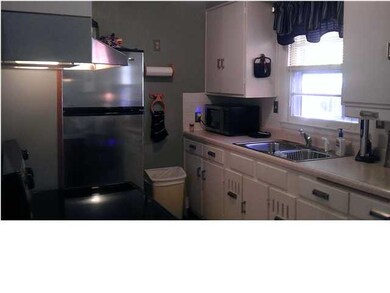 Kitchen with new cabinet/drawer hardware and floor