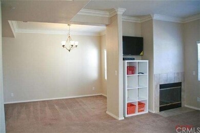 View of living room and dining room from front doo