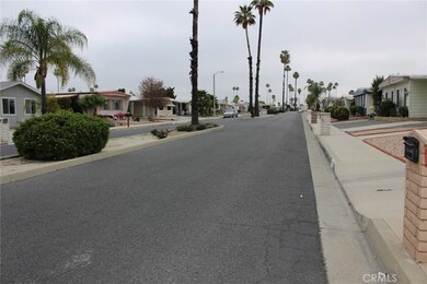 View of the wide street with the traffic separator and landscaping.