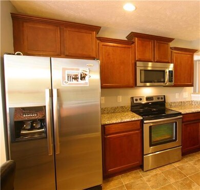 Detail of the Kitchen Cabinets, Granite Counters and Stainless Appliances.