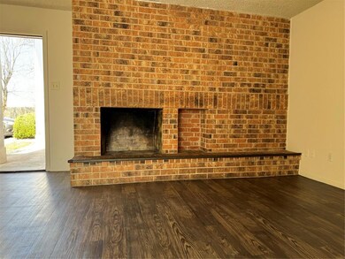 Unfurnished living room featuring a textured ceil