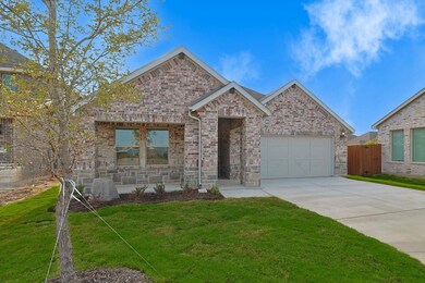 A beautiful brick and stone elevation welcomes you to 3305 Chasemoor Drive.