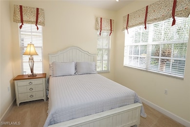 Carpeted bedroom with baseboards