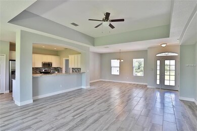 HOME FEATURES AN OPEN CONCEPT FLOOR PLAN IDEAL FOR